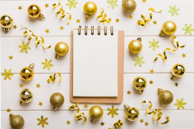 Christmas blank greeting card mock-up scene. Creative layout made of Christmas tree branches and paper card note. Flat lay. Nature New Year concept.