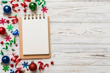 Christmas blank greeting card mock-up scene. Creative layout made of Christmas tree branches and paper card note. Flat lay. Nature New Year concept.