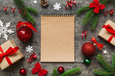 Christmas blank greeting card mock-up scene. Creative layout made of Christmas tree branches and paper card note. Flat lay. Nature New Year concept.