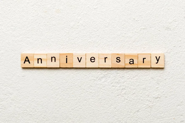 Anniversary Word Written Wood Block Anniversary Text Cement Table Your — Stock Photo, Image