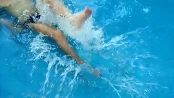 Boy Splashing Water His Feet Pool Summer Vacation Concept Water — Stock Video