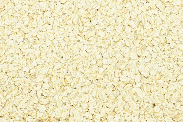 Porridge oats or oatmeal background — Stock Photo, Image