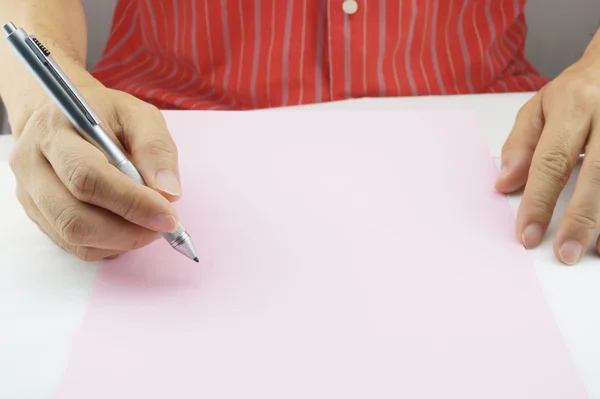 Man planning business on pink paper — Stock Photo, Image