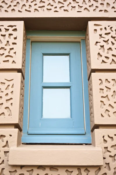 Blue square window in brown wall at Grand Palace — Stock Photo, Image