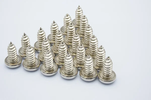 Screws placed in a triangle — Stock Photo, Image