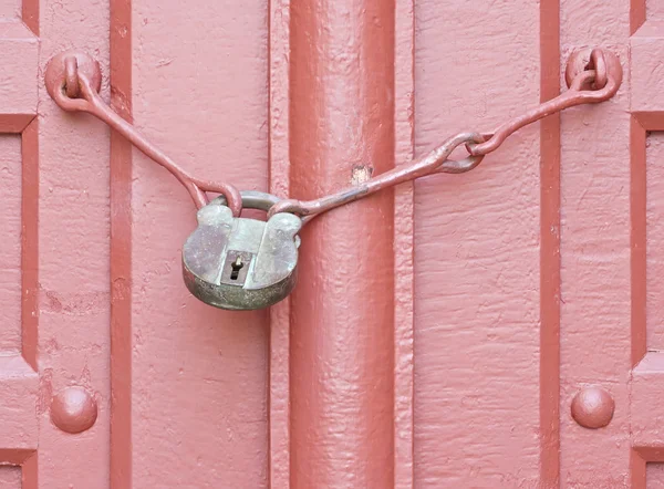 Antique door key with red door — Stock Photo, Image