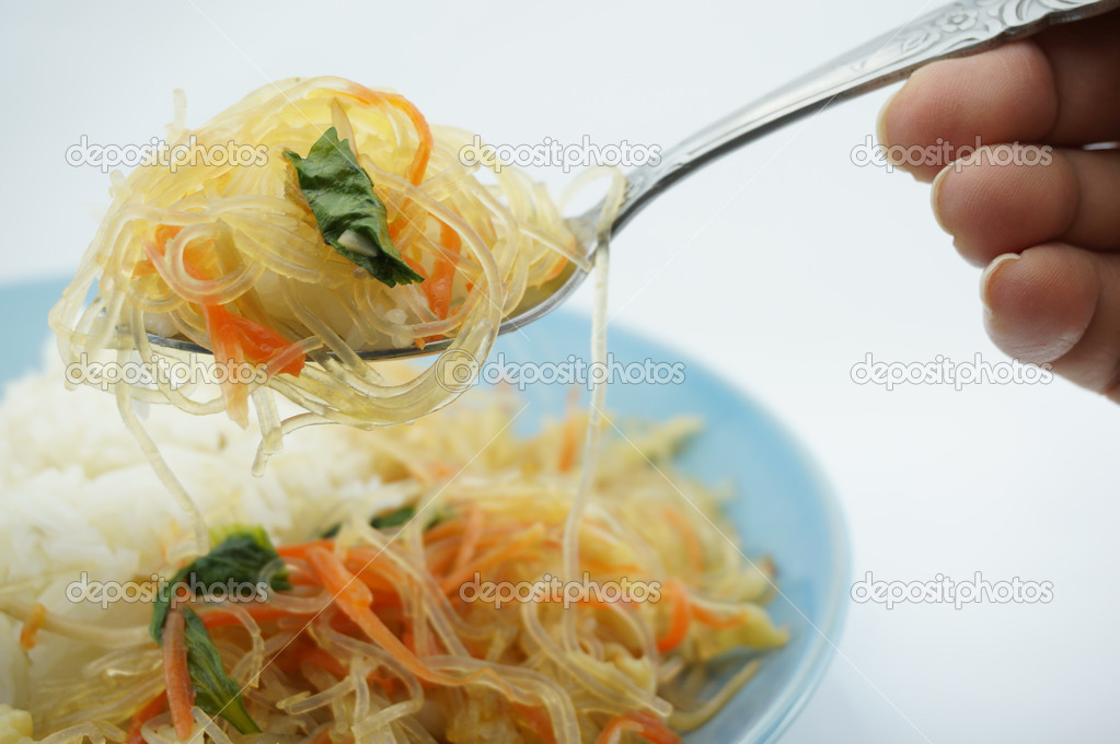 Eating Vegetarian fried vermicelli with rice
