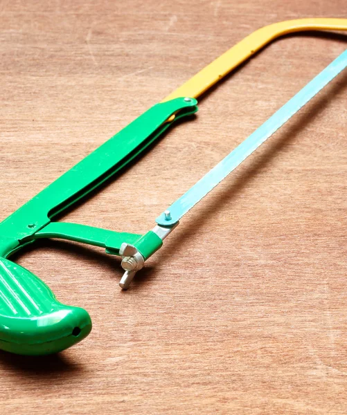 Green and yellow saw — Stock Photo, Image