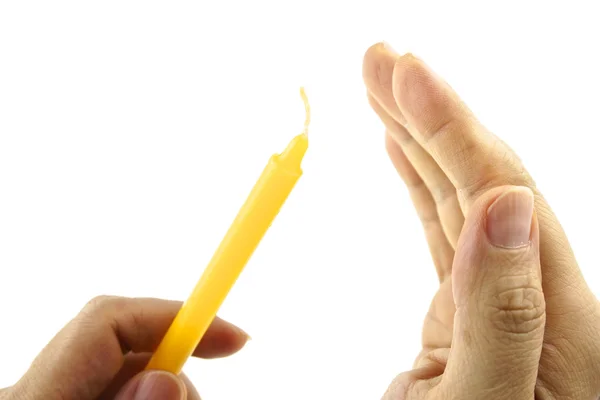 Hand hold yellow candle and shield wind isolated — Stock Photo, Image