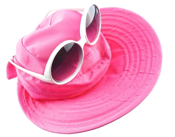 Weiße Sonnenbrille auf rosa Hut aufgesetzt — Stockfoto