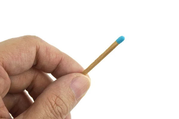 Hand hold blue matchstick for lit isolated Royalty Free Stock Photos