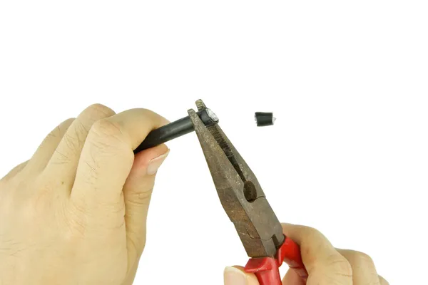 Man use old pliers to pinch cable line for repair isolated — Stock Photo, Image