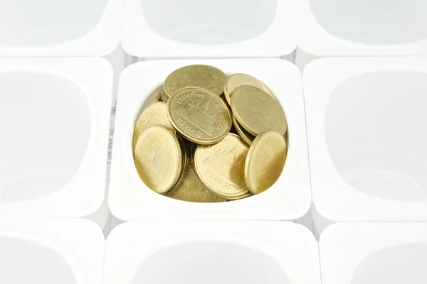 Gold coin in cup — Stock Photo, Image