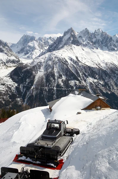 The house and tractor on a background of mountain — Stock Photo, Image