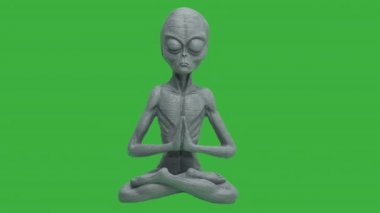 Yeşil arka planda lotus pozisyonunda oturmuş meditasyon yapan bir uzaylı.