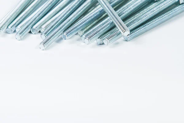 Chrome bolts on plain background — Stock Photo, Image