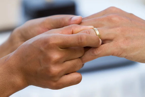 Hand putting a wedding ring — Stock Photo, Image
