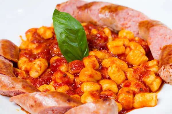 Gnocchi with fresh Italian pork sausage — Stock Photo, Image
