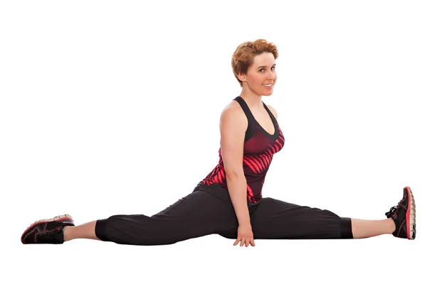 Fitness woman doing stretching exercise isolated on white — Stock Photo, Image