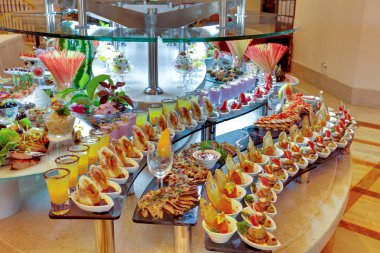 Buffet with different appetizers clipart