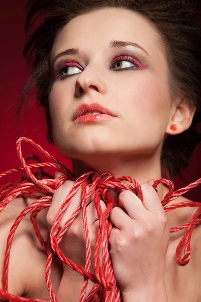 Youg woman with red web — Stock Photo, Image