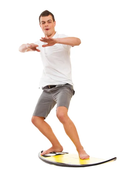 Homem posando com uma prancha de surf — Fotografia de Stock