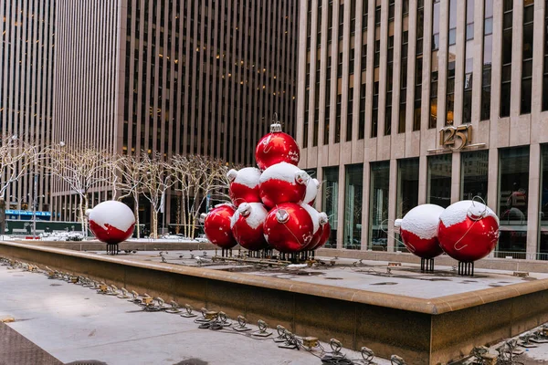 New York City landmark, Giant Christmas Ornaments near Radio City Music Hall in Rockefeller Center in Midtown Manhattan NYC