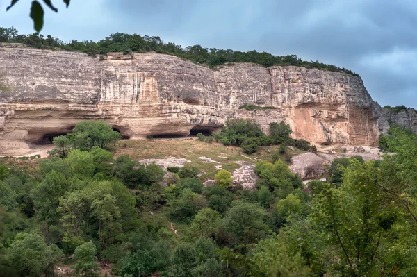 Rock with caves — Stock Photo, Image