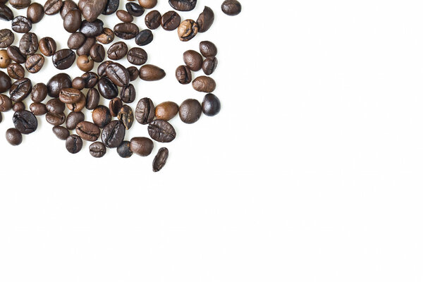 Close up of mixed coffee beans on a white background
