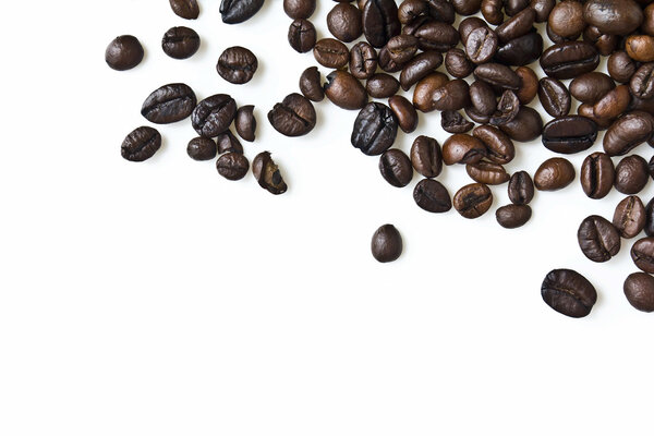 Close up of mixed coffee beans on a white background