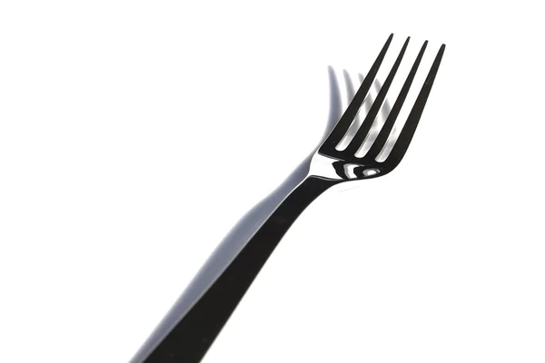 A white plate with silver fork — Stock Photo, Image