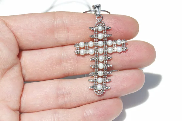 White gold pendant in the shape of a crucifix — Stock Photo, Image