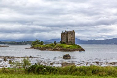 Stalker Castle is a tower house on a small island in Loch Laich, an inlet of Loch Linne, near the island of Shuna clipart