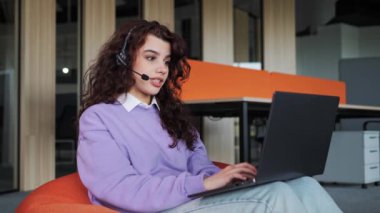 Female customer support operator assistant working online from office technical support internet communication headphones microphone. Call center, agent provide service on video conference call.