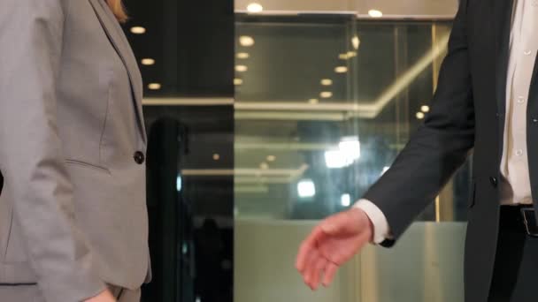 Close up woman and man hands business people partners shaking successful corporate partnership deal welcoming opportunity in modern glass office agreement professional greeting meeting partners. — 비디오