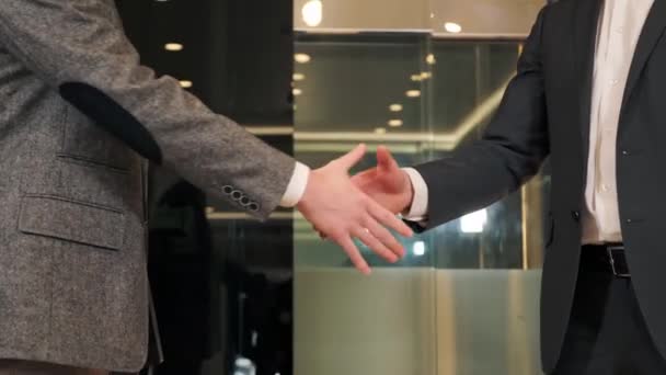 Close up handshake business people partners. Teamwork. Partner ship. Shaking hands. Two men shake hands, conclude successful contract agreement, sign of support for partnership cooperation, deal. — ストック動画