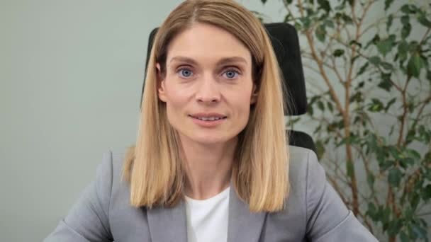 POV of caucasian entrepreneur female leader on online video call, listening to his partners, nodding agree working from office. Remote worker on computer conference communication internet web view. — Vídeo de Stock