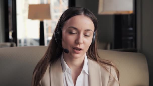 Smiling Beautiful Long Hair Woman Headset Using Laptop Talking Working — Stockvideo