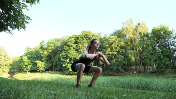 Full Length Shot Pretty Athletic Young Woman Doing Squatting Exercise — Stockvideo