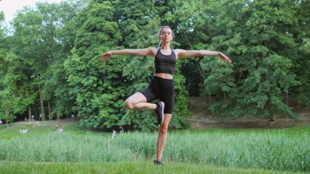 Slim Young Blonde Woman Does Stretching Exercise Standing Yoga Pose — Stock videók