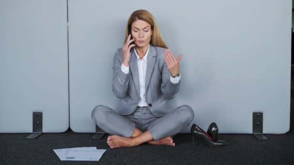Nervous Tired Businesswoman Talking Phone While Sitting Floor Her Shoes — Vídeos de Stock