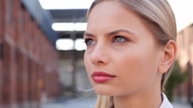 Portrait female face, beautiful pensive confident blond sexy woman looking ahead feeling free enjoy fresh air. Gorgeous pretty girl with deep eyes, beautiful lips and perfect skin inspired by nature