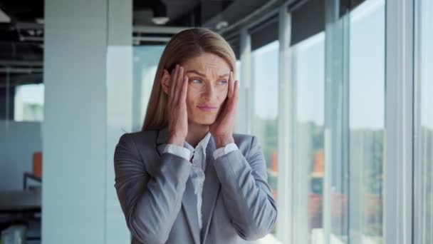 Corporate Serious Businesswoman Formal Suit Standing Office Having Bad Headache — Stockvideo