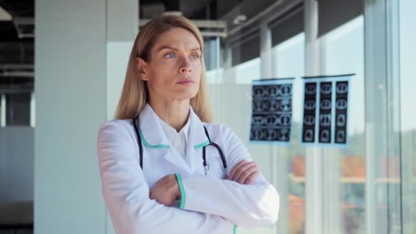 Pensive Young Female Caucasian Doctor White Medical Uniform Look Window — Wideo stockowe