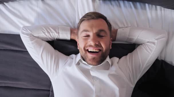 Man Lying Bed Relaxing Hard Day Enjoying Soft Mattress Pleasant — Vídeo de stock