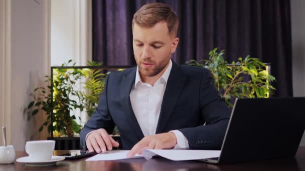 Serious Handsome Business Man Using Mobile Phone Reading Financial Report — Stockvideo