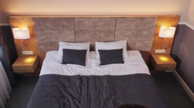 Businessman falls on soft bed with arms raised feels happy, relish fresh beddings linen, enjoy holidays, accommodation in hotel. Relax, vacation, travel, comfort mattress for quality healthy rest
