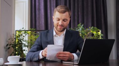 Businessman takes an envelope with 100 dollar banknotes. Counting hundred dollar banknotes in a hands and puts it in his pocket. Illegal deal with money. Corruption. Envelope salary. Tax cheating