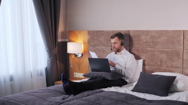 Business Man Wear Headset Video Conference Calling Laptop Computer Bed — Wideo stockowe