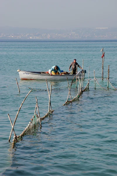 Fishermen checking their nets at Lake Garda — Stock Photo, Image